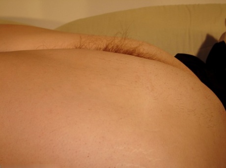 Fat blonde amateur Amber exposes her saggy juggs and hairy pussy up close