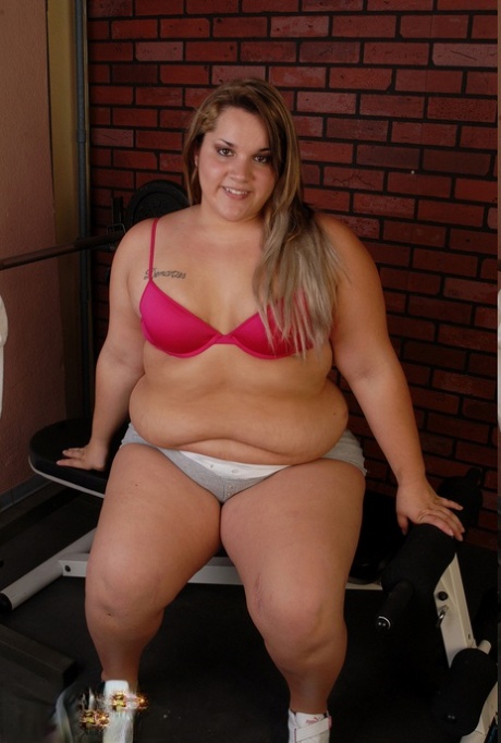 Fat Caucasian amateur teen Christina strips naked & touches her hairy cunt