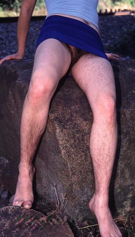 Hairy amateur doll Maura undressing outside and showing her super furry crotch