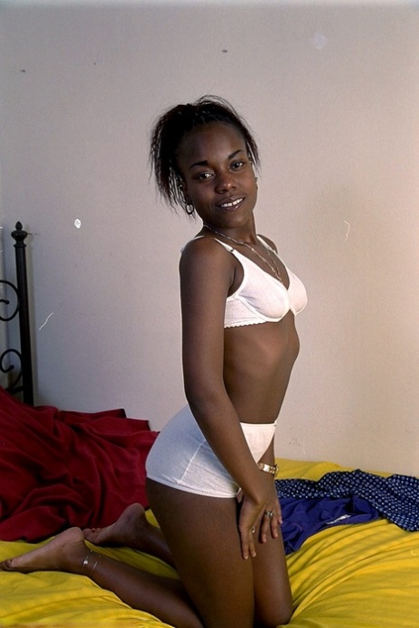 Petite ebony Jezebel squeezes her tiny tits and shows her big booty