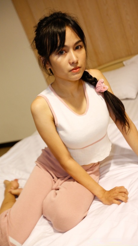 Pretty Asian babe Aye shows her lovely tits before having POV sex