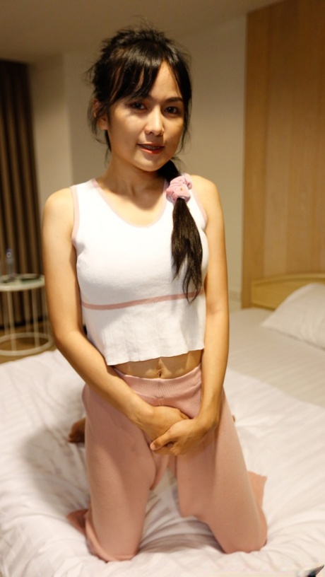 Pretty Asian babe Aye shows her lovely tits before having POV sex