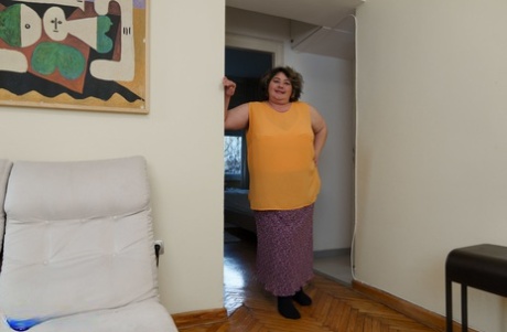 Hot teen Emily F and fat granny Edina pose in their living room