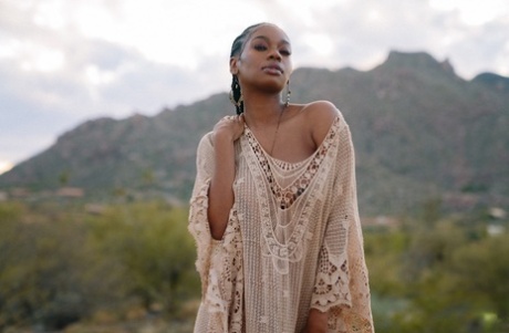 Beautiful ebony babe Nyla shows her juicy melons in a sexy outdoor striptease