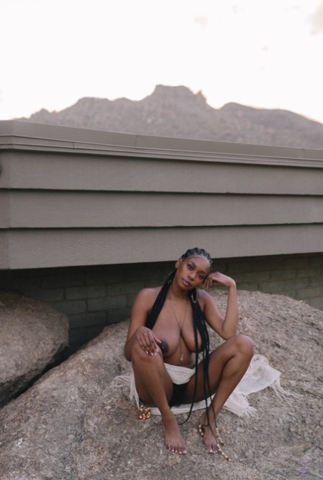 Beautiful ebony babe Nyla shows her juicy melons in a sexy outdoor striptease