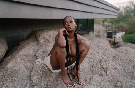 Beautiful ebony babe Nyla shows her juicy melons in a sexy outdoor striptease