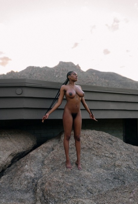 Beautiful ebony babe Nyla shows her juicy melons in a sexy outdoor striptease