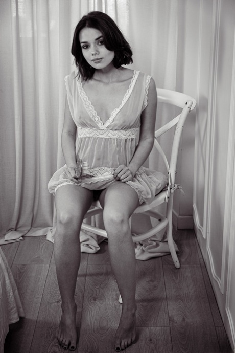 Sweet blue eyed teen Keira Blue exposes her yummy twat and poses on a chair
